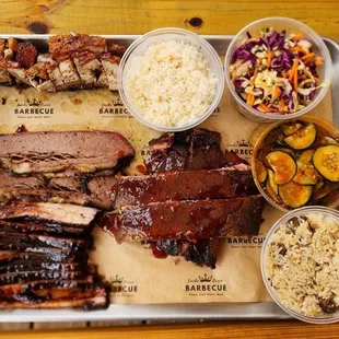 Siu Yuk, Brisket, Cha Siu, Pork Ribs, Dirty Rice, Cucumber Salad, Sesame Slaw, Chicken Rice.