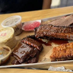 Brisket, spare ribs, dino beef rib. Crispy pork belly, bitty rice, Mac and cheese, and spicy cucumber. DELICIOUS!