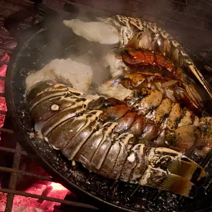 grilled lobsters and potatoes