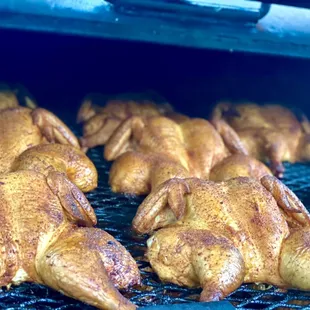chicken cooking on a grill