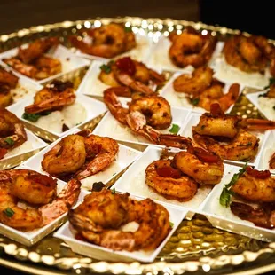 a platter of shrimp appetizers