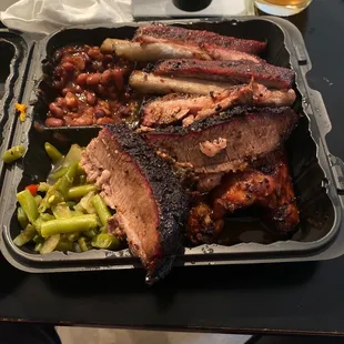 The &quot;Big stack&quot;. Barked Brisket like it&apos;s supposed to be done. Ribs oh my. And those Beans!!!!