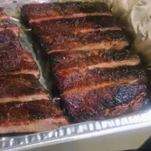 a tray of ribs on a table