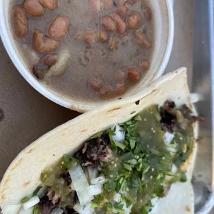 Brisket taco with beans.