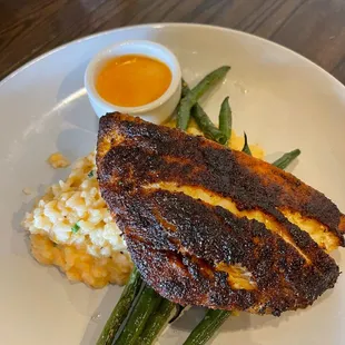 I had the redfish and would order it again. Delicious. The pork was amazing. And oh my god the mac and cheese.