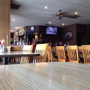 Restaurant seating toward kitchen.