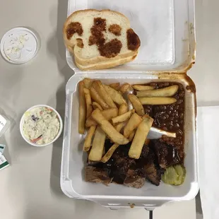 Burnt end dinner with a side of coleslaw