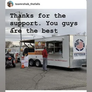 a man standing in front of a food truck