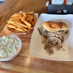 Pulled Pork Sandwich with side of Cole slaw &amp; seasoned fires.