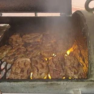 smoke coming out of a grill