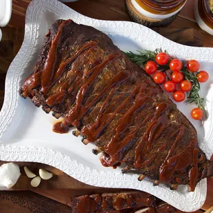 Our delicious Pork Spare Ribs are a Kansas City mainstay. Each tender, meaty slab is expertly rubbed with our own special ble...