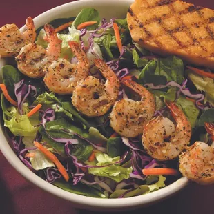 Caesar salad topped with 5 sugar cane skewered shrimp, topped with Caesar dressing. Served with garlic bread.