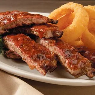 Our tender, meaty Babyback Ribs are hickory smoked with an amazing flavor and a pink smoke ring just below the surface...