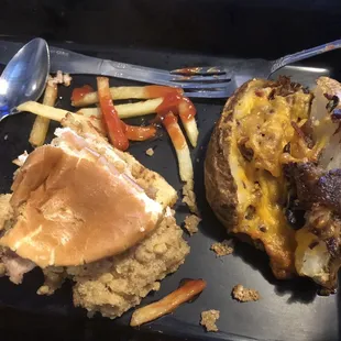 Poor photo of my half of GF tenderloin and loaded baked potato