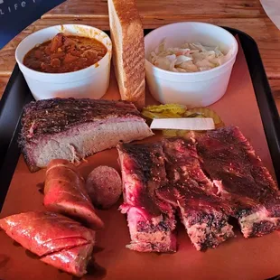 3 meat plate brisket, ribs, jalapeños cheddar sausage, beans &amp; coleslaw.