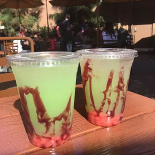 Green apple lemonade with sour cherry bomb drops. One of the best Disney Halloween drinks!