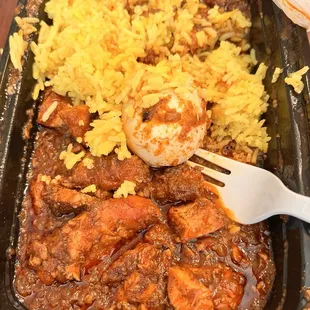 Smoked doro wot (I put some rice in the gravy because it needed flavor; rice was very bland.)