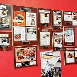 a wall full of framed and unframed menus