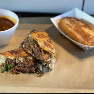 Quesabirria special with a side of Garlic Texas Toast!