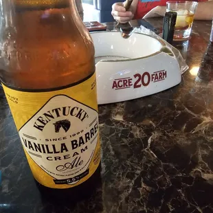 Kentucky Vanilla Barrel Cream Ale and a BIG ole cigar ash tray in the background.