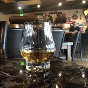 Cigar lounge area at Smoker's Choice Cigar Bar with a little treat for a midday break.