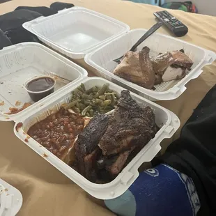 Chicken and ribs, with greens and baked beans.