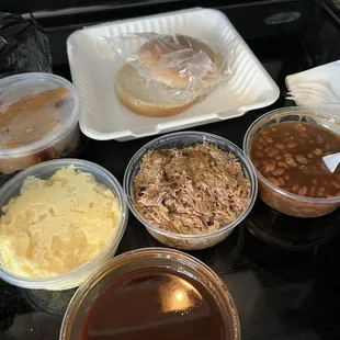 Pull pork, baked beans, potato salad, peach cobbler