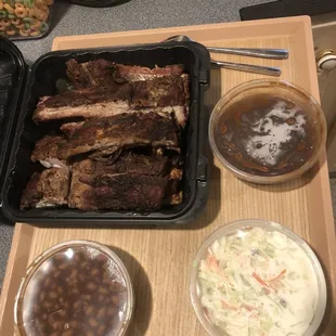 Half rack BBQ pork ribs, baked beans, coleslaw, BBQ sauce.  All delicious!