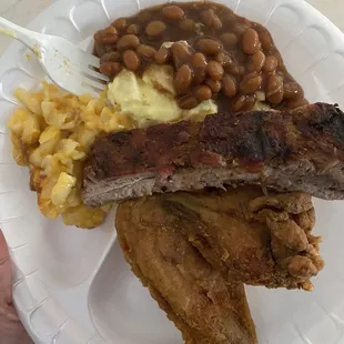 Chicken wings, ribs, beans, potato salad, and Mac and cheese