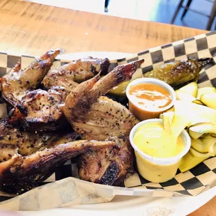 Smoked chicken wings with assorted pickled sides