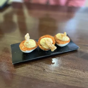 Deviled eggs with pork skin