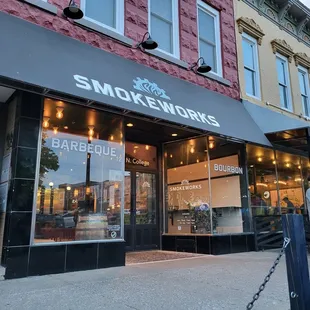 a group of people walking in front of a store