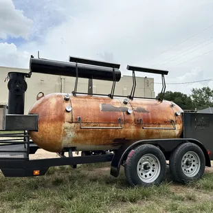 a propanene trailer parked in a field