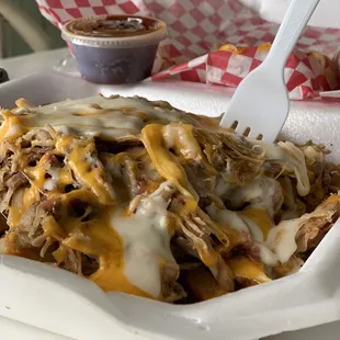 Pork bbq on top of fries Smothered in cheese with moonshine bbq sauce.