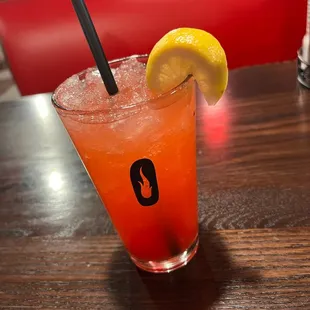 a drink with a slice of lemon