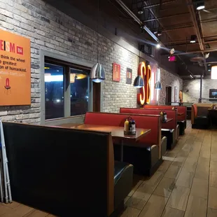 The booths bt the door.