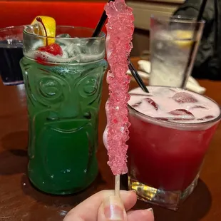  hand holding a candy stick