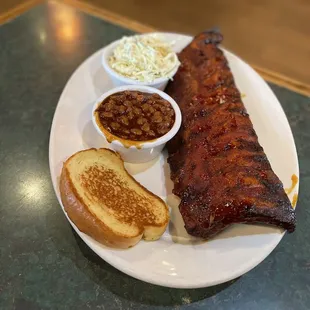 $19.99 full baby back rack with 2 sides, garlic bread and a drink.