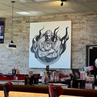 a bar with red chairs