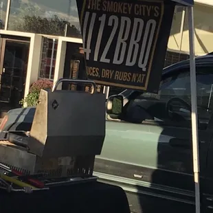 a man sitting at a grill