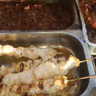 skewers of meat on skewers