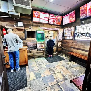 ows two men standing at the counter