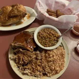 Combo ribs and pork with baked beans and red slaw, half chicken, hush puppies.
