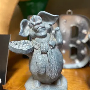 an elephant holding a bowl