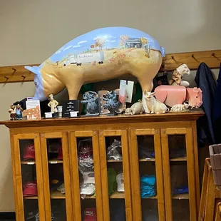 a pig on top of a cabinet