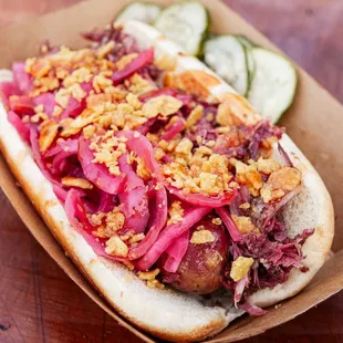 a hot dog with pickles