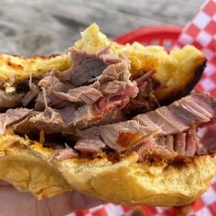a pulled pork sandwich in a basket