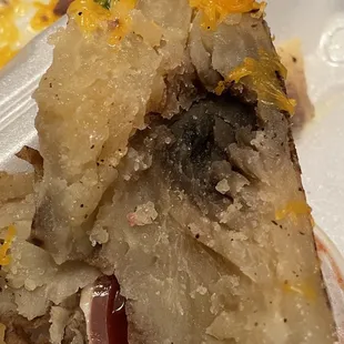 a piece of food in a styrofoam container