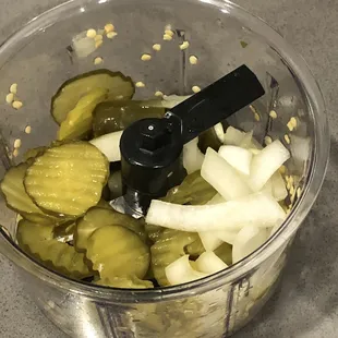 Dicing up some pickles, onions, and jalapeños to make a relish to add to the chopped beef baked potato I'm having for dinner !!!
