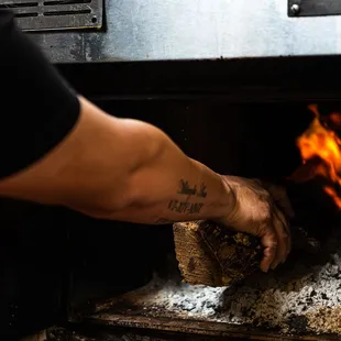 Log going into the firebox
